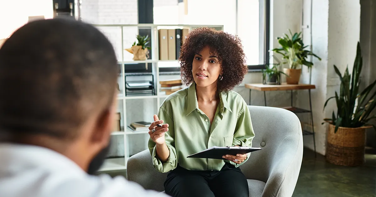 A therapist listening attentively during a counseling session